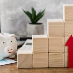 Stacked wooden blocks denoting money increase