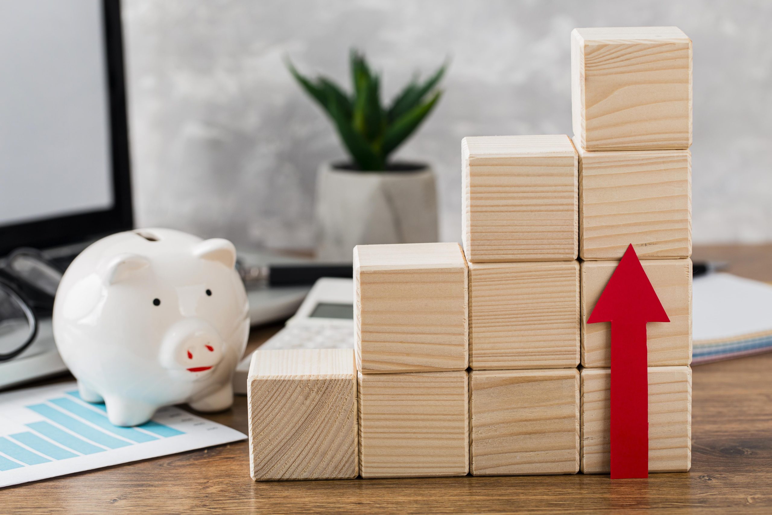 Stacked wooden blocks denoting money increase