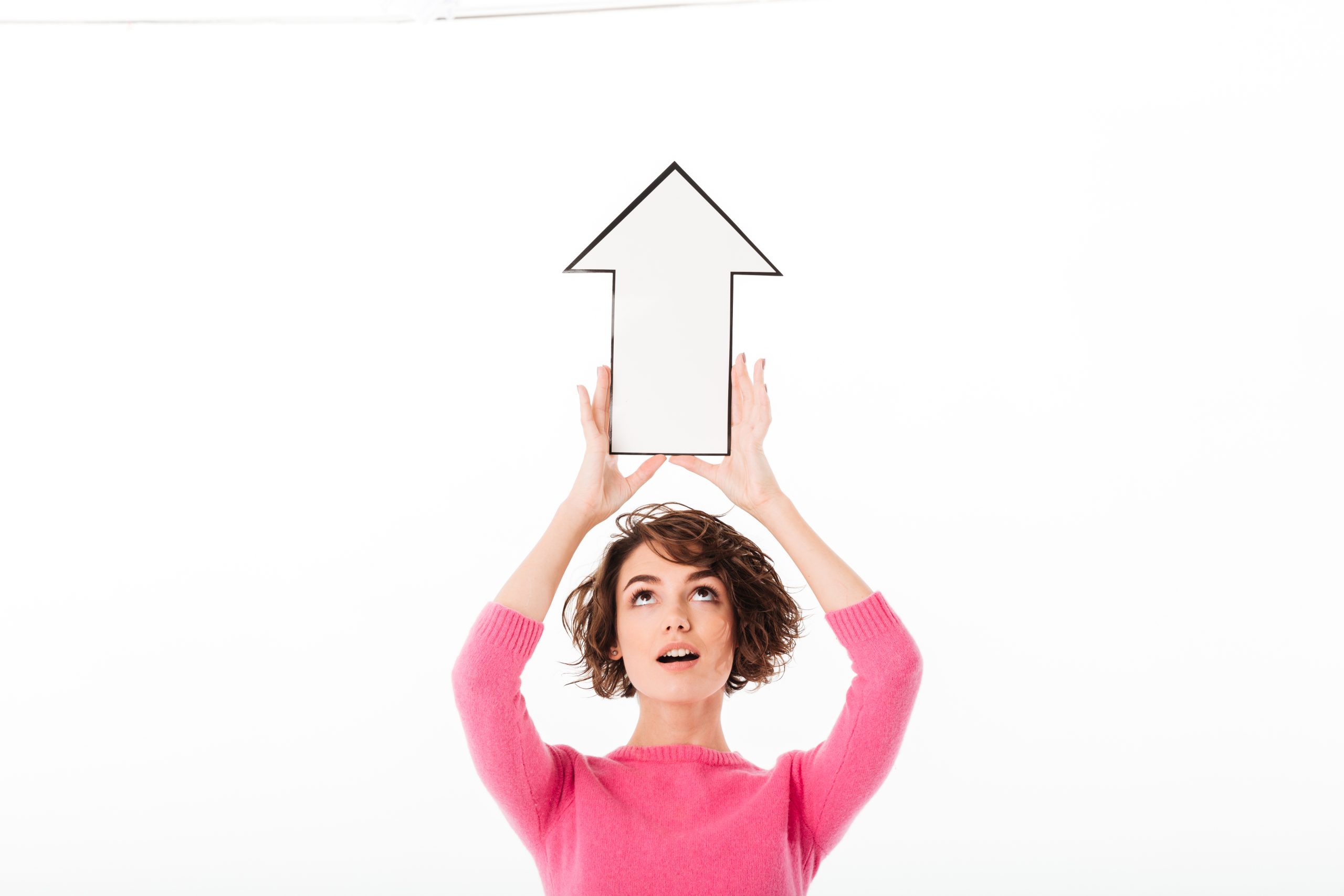 Woman holding an arrow pointing upwards